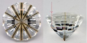 faceted gemstone with rutile needle